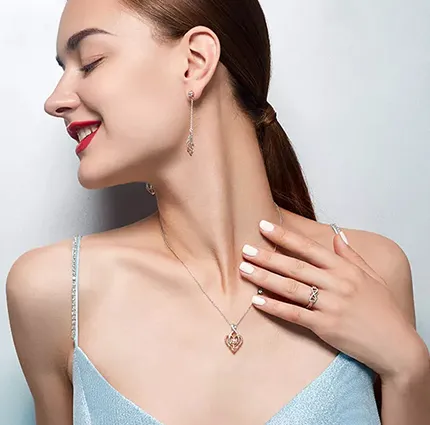 Model wearing infinity heart anchor jewelry set