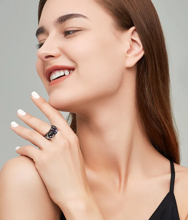 Model wearing a skull and butterfly ring