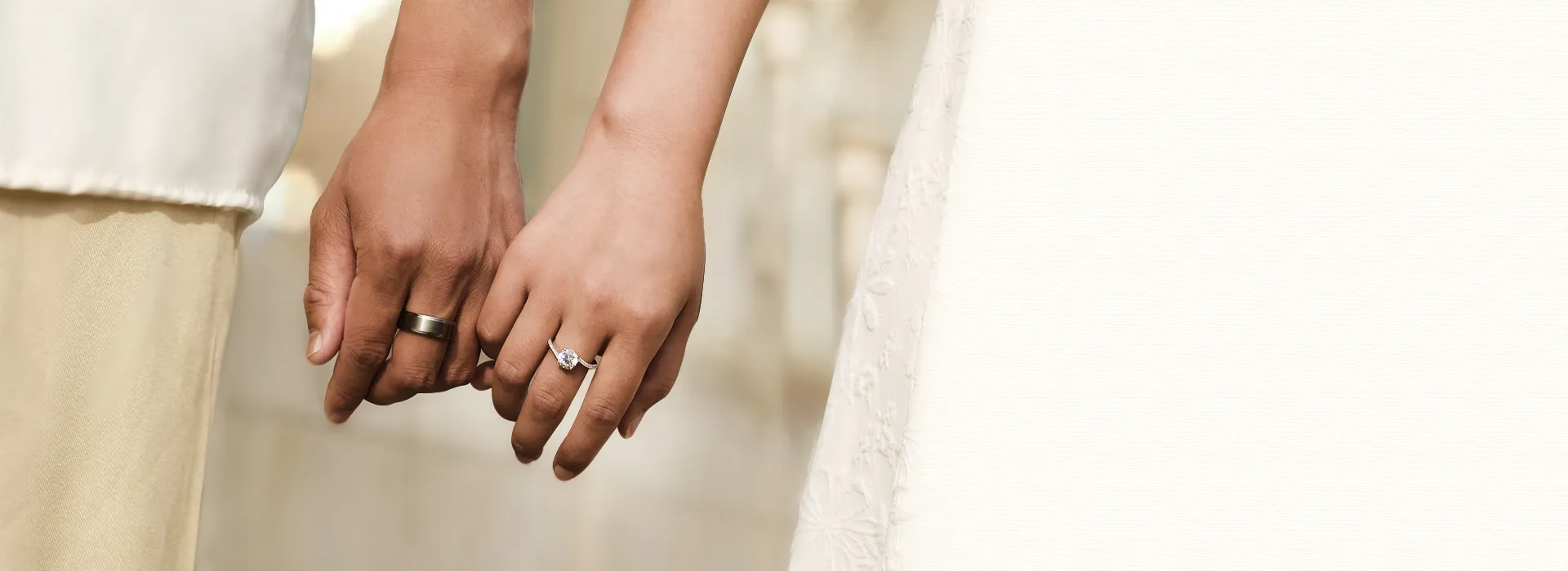 Couple Holding Hands with VANCARO Wedding Rings
